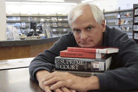 Relying on law books borrowed through the local library, Leonard Porto is challenging the city’s policies towards homeless people. His case is being heard next week.