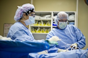 Orthopedic surgeon Robert Montgomery, M.D. (right) is shown with surgical tech Marisa Althaqeb in Laguna Hills’ Saddleback Outpatient Surgery Center, a trend to move surgeries outside of hospitals.