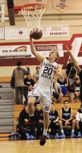 Senior Cole Kesler gets free on a fast break for an easy bucket against Salesian in Laguna's 66-33 first round CIF victory at home.