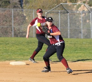Sophomore second baseman Katyn Ott throws to first for the put out during Laguna’s season and home opener against Capistrano Valley Christian at the Breaker’s Thurston Middle School field.