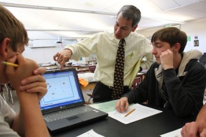 Student Andrew Couse receives an explanation from science teacher Steve Sogo.