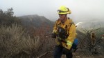 3.1 Firefighter Chris Ornelas comes up to the ridge line after putting out a hot spot fire