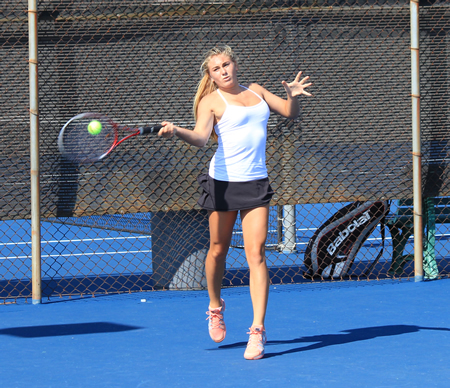 Laguna's top singles player Kira Hamilton hits a return during a match against Irvine's Northwood on Tuesday, Sept. 10. The Division 2 Breakers couldn't keep pace with the Division 1 power, losing 6-12. Hamilton went 1-2 in her three matches.
