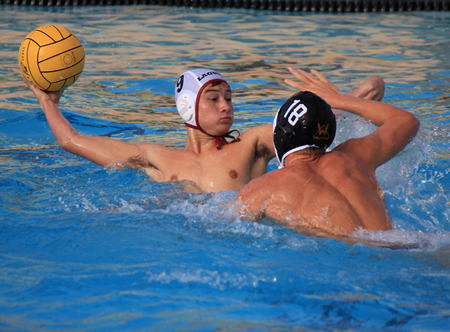 Junior Aki Anderson, who scored two goals, looks for an open teammate during a road game where Laguna lost 8-7 against Foothill High Tuesday, Oct. 8. Photo by Robert Campbell.