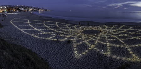 Not even this five image panorama is wide enough to contain Jim Denevan's entire Land Art sand drawing at north Main Beach, only steps from the Laguna Art Museum.   Photos by Mitch Ridder