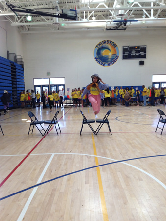 A student masters chair hurdling in costume, an Epic challenge. 