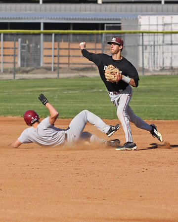 Varsity short stop Preston GrandPre completes a double play. JV and varsity teams are off to a 4-0 league record so far this season. Photo by Peter Schineller.