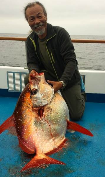 Tosh Williams of Irvine with a 50-pound opah, caught  Sunday 40 miles south of Dana Point. Photo courtesy of Dana Wharf Sportfishing