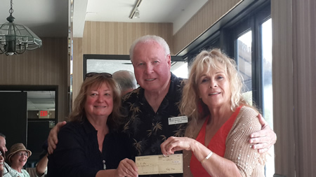 From left, Katy Moss of the local Exchange Club and district Exchange Club president Al Hicks present an award to Rosalind Russell, of the R Star Foundation of Laguna Beach. Her work in Nepal advancing children’s causes dovetails with the Exchange Club’s mission as well. 