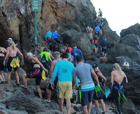 Aquathoners navigate the rocky point at the south end of Emerald Bay. Credit: Robert Campbell 