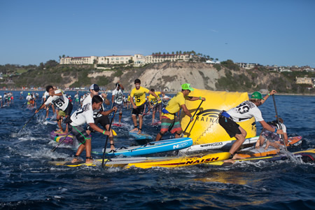 Racers round the buoy during the Battle of the Paddle, held for the first time last weekend at Salt Creek Beach in Dana Point. The big swell made entry into the ocean challenging, but an exhilarating ride to the finish. 