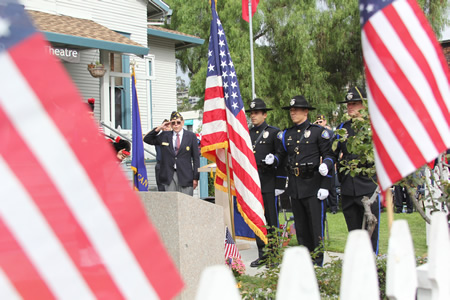 A half-dozen speakers followed the presentation of the flag by a police color guard during a Veterans Day ceremony Tuesday at Legion Hall in Laguna Beach. They included a representative of John Wayne Airport’s newly opened United Service Organization lounge, the first new USO in the county since 1947. American Legion Post 222 organized the ceremony.