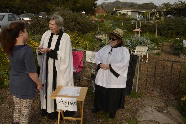 The Rev. Andrea Paddock, left, and Joan Milliman, greet a observe Ash Wednesday in the garden.Photo by Greg O'Loughlin.