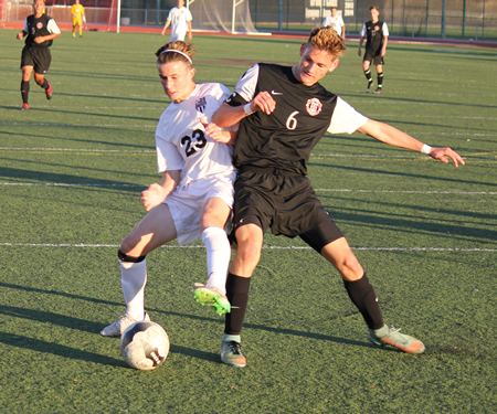 Freshman Carson Cushing battles for the ball against a Hart defender during Laguna’s second round CIF loss on Wednesday, Feb. 25, at Guyer Field. photos by Robert Campbell.