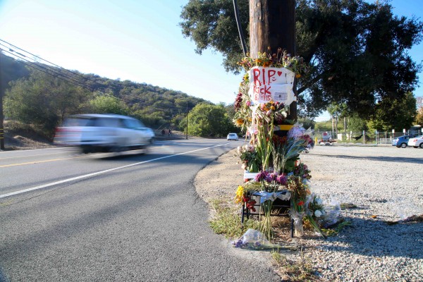 Friends remember Richard McCrary at a roadside shrine. Photo by Jody Tiongco