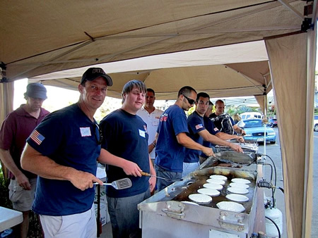 Firefighters flipping flapjacks for the Exchange Club fundraiser.
