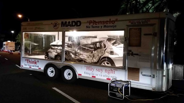 Motorists got an up close view of a crashed car in a Mothers Against Drunk Drivers trailer while waiting to go through police checkpoint near Crescent Bay this past Friday, Dec. 18. Photo courtesy of the LB Police Department..
