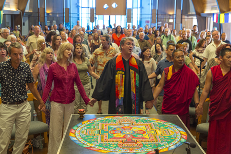 The Rev. BJ Beu, center, takes part in a ceremony at the Neighborhood Congregational Church last October marking the completion of a sand mandala by visiting Tibetan monks.Photo by Tom Lamb.