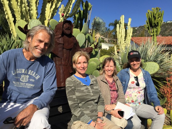 From left, Mark and Cindy Evans finalize plans with Jeanne Yale and Nancy Englund of the Laguna Beach Garden Club to open their historic home for the May 6 tour.
