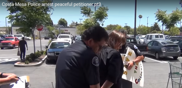 Debbie Tharp, medical marijuana initiative proponent, says the image shows her arrest at Mother's Market by Costa Mesa police four years ago. Tharp was collecting signatures for legal dispensaries. She spoke at the City Council meeting Tuesday, urging members to legalize medical marijuana stores. 