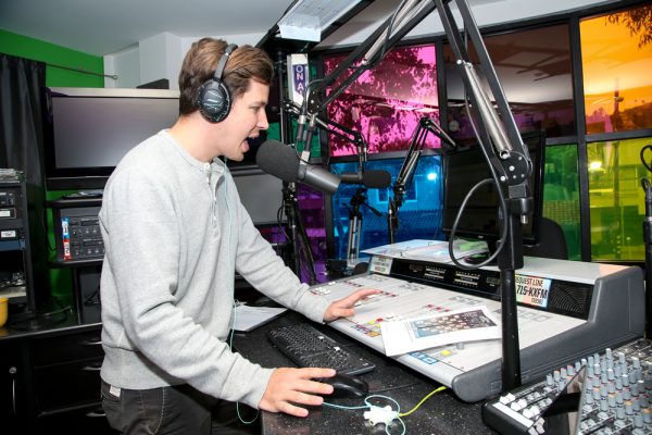 Radio station program director Tyler Russell in the morning drive slot. Photo by Jody Tiongco.