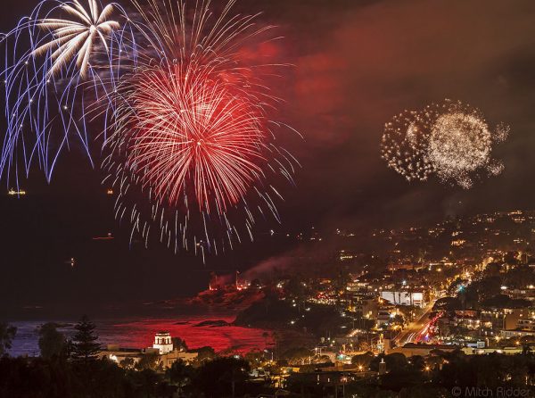 Fireworks show ignites over Main Beach, planned for 9 p.m. Monday, July 4. It originates in Heisler Park at Monument Point, which is typical-ly closed in preparation. Trolleys will run on shortened schedule, 9:30 a.m. to 7 p.m. Photo by Mitch Ridder
