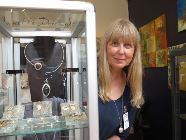 Jewelry,sculpture and paint artist Annette Doreng-Stearns in the Sawdust booth. -- 