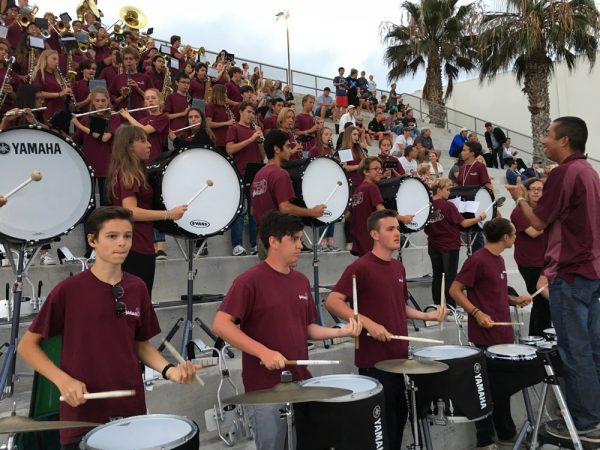 The LBHS Marching Band performs in the grandstand under the direction of Jeremy Chung during the varsity football win Friday, Sept. 2.Photo by Tom Fay.    