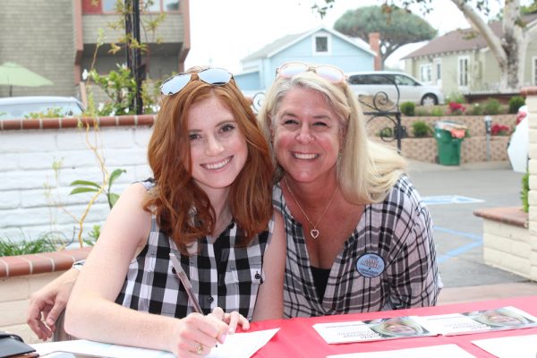 City treasurer candidate Ann Mc Graw, right registered Cassidy Kelly to vote on Sunday at the Laguna Beach Woman's Club voter registration drive.