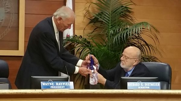 Richard Dietmeier, right, receives a parting gift from Wayne Rayfield. 