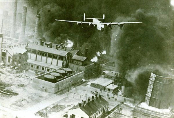 Robert Sternfels pilots a B-24 in an airstrike at an oil refinery at Ploiesti, Romania, Aug. 1, 1943.Photo from the 44th Bomb Group Photograph Collection.