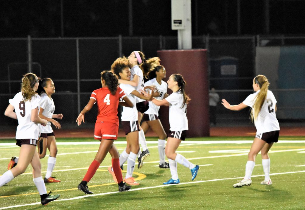 The girls varsity soccer squad celebrates its playoff march with a 3-0 win Tuesday, Feb. 21, in Whittier over California High. Breakers, with a 20-3-2 record, host Bloomington in the quarterfinal kicking off at 5 p.m. at home Friday, Feb. 24. Photo courtesy of Coach Bill Rolfing