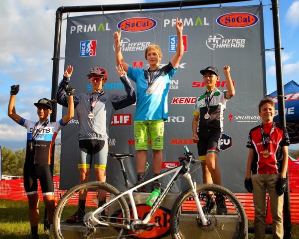 Jackson Golden, center, from Laguna Beach Interscholastic Mountain Bike Team places first among other medalists, from left, Ethan Villaneda from Corona, Tristan Carmell from Yucaipa, Daniel Hirota of Simi Valley and Louis Poiriez from South Orange County Composite. 