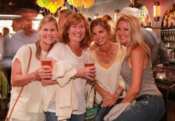 From left, supporters Beth Knapp, Kathie Flynn, Sam Washer and Nancy Jackson raise a toast at a previous Laguna Food Pantry fundraiser.