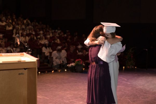 Student Lillian Cook embraces her benefactor for a $1,500 gift from the Nolan Watters Memorial Scholarship at the high school Honors Convocation last week. Photos courtesy of LBHS Scholarship Foundation