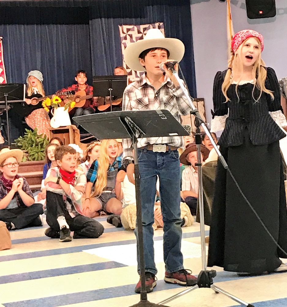 Parker Brown, left, and Lauren Kimball sing solos during the Pioneer performance.