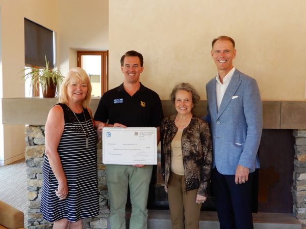 From left, organizers of Lifelong Laguna, Kristine Thalman and John Fay, receive financial backing from leaders of the Laguna Board of Realtors, Lauriann Meyer and Charles Brickell, executive director and president, respectively.   