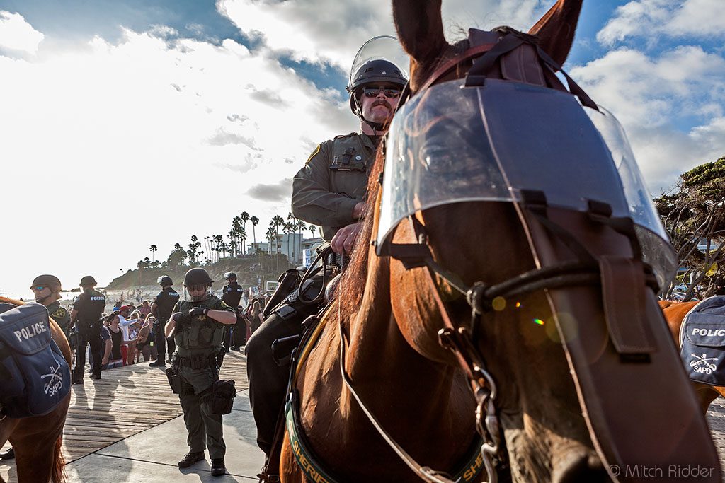 Mounted police proved an invaluable resource for crowd control during a largely peaceful political demonstration that at its peak drew 2,500 people to Main Beach on Sunday, Aug. 20. Photo by Mitch Ridder