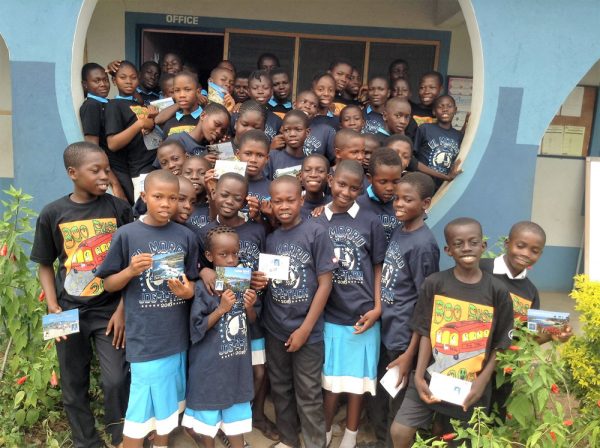 Students in Ghana proudly show the letters and t-shirts they received from El Morro fourth-graders. Photo by Heather Besecker