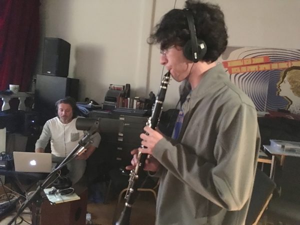 Koby Taswell plays clarinet as Jason Feddy records. The teen took part in Music In Common, an intercultural songwriting experience, earlier this month.