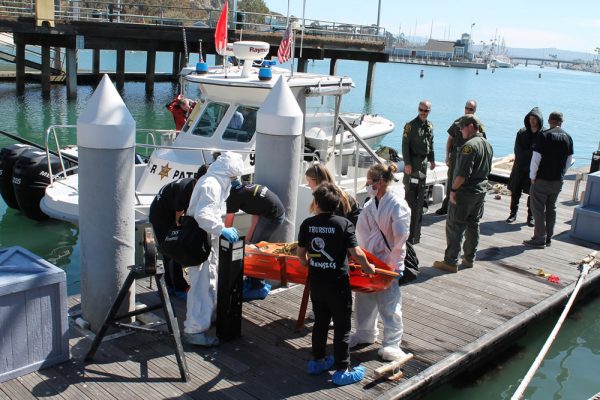: Thurston students transport a “body” recovered from the ocean for forensic investigation.   