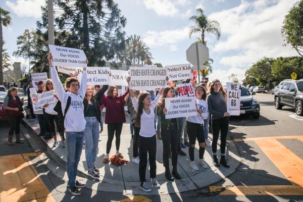 A group of Laguna Beach High School students protest gun violence at the corner of Park Avenue during the national student walkout on Wednesday morning. Photo by Allison Jarrell