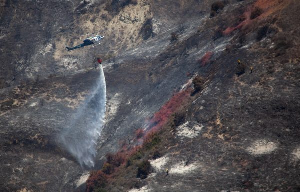 A helicopter drops water on a hot spot Sunday, June 3. Photo by Allison Jarrell.
