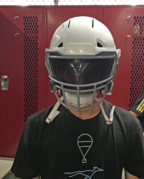 Football player Dyland Davis in a new helmet.