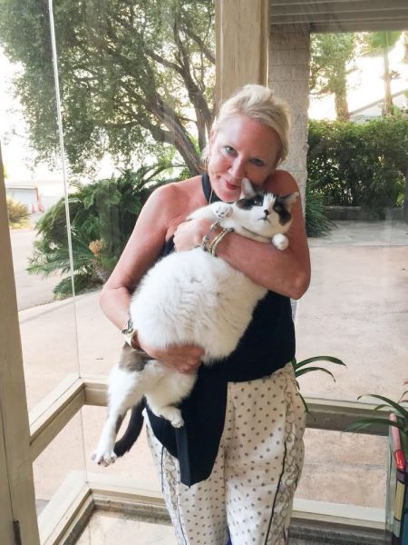 Gail Landau with her 24-lb adopted snowshoe cat, Mr. Misaki, who will take on a new title as CCO, chief cuddle officer.