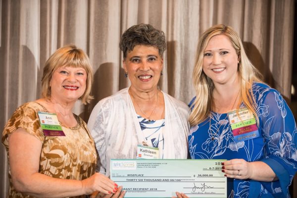 Kathy Bowman, center, of WisePlace, the largest Impact Giving grant recipient, flanked by the organization’s members Ann Owen, left, and Jennifer Lipinski. Photos courtesy of Impact Giving