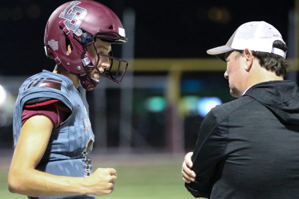 Andrew Johnson and Coach John Shanahan talking it over against Big Bear last Friday night. Photo by Lisa Fields
